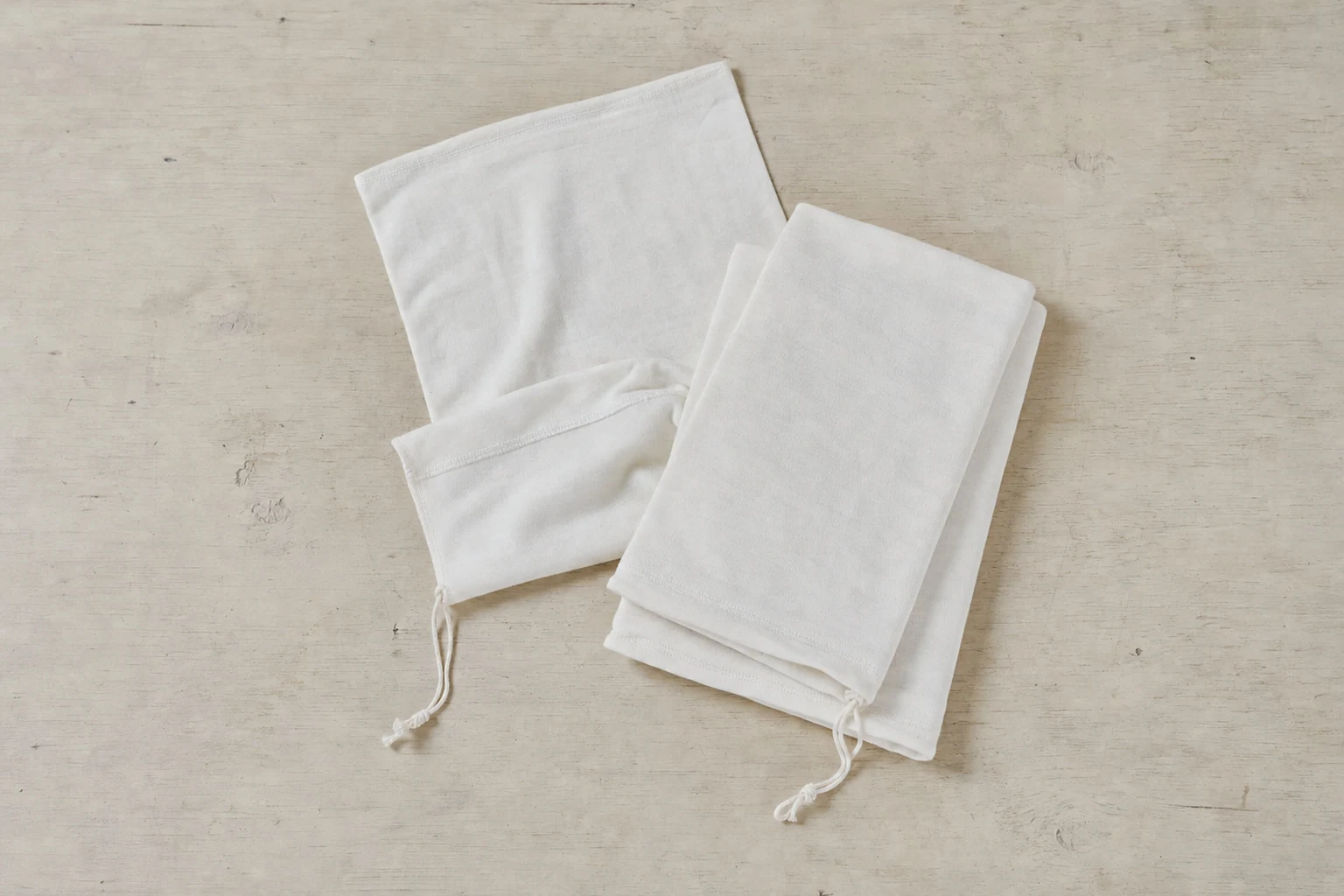 Folded cotton game bags in assorted lengths