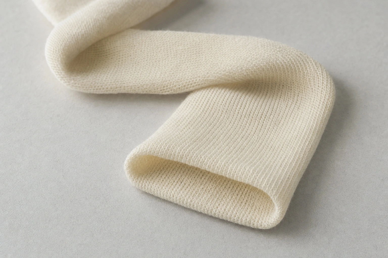 Stockinette tube opening and knitted fabric detail